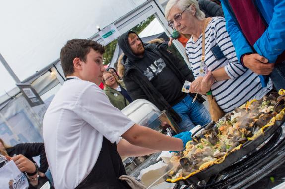 Henry's Bayhouse Serving Customers their Giant Seafood Paella